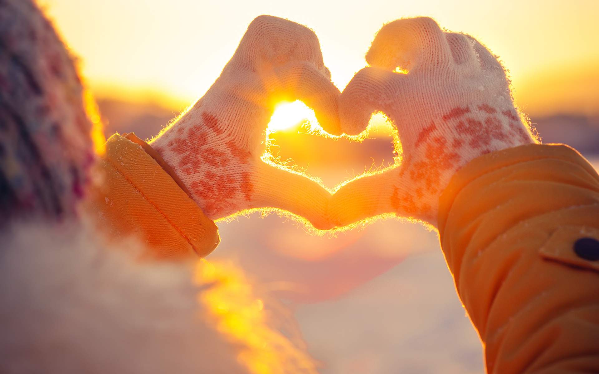 3 Mindful Practices to Deepen Your Connections - Woman hands in winter gloves making a heart shape