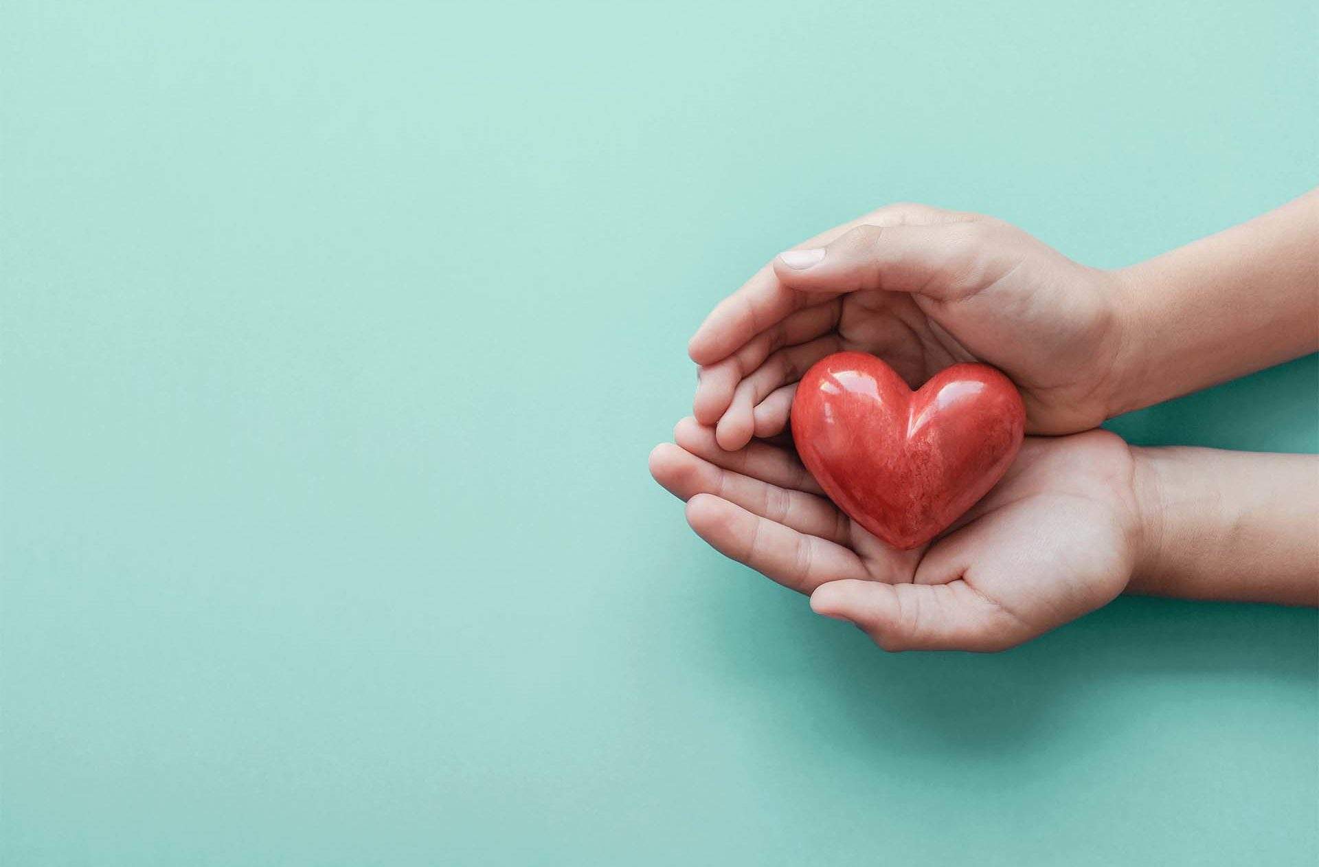 A Practice to Welcome Gratitude with Sharon Salzberg_Two hands holding a red heart